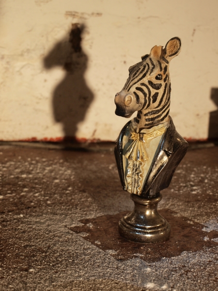 A small zebra figurine.
