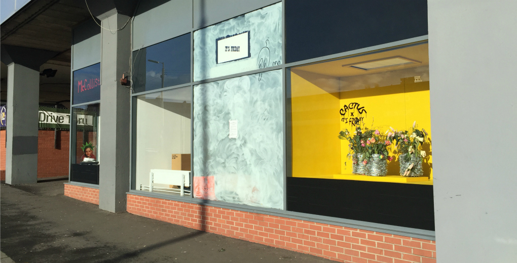 A view from the street into gallery windows.