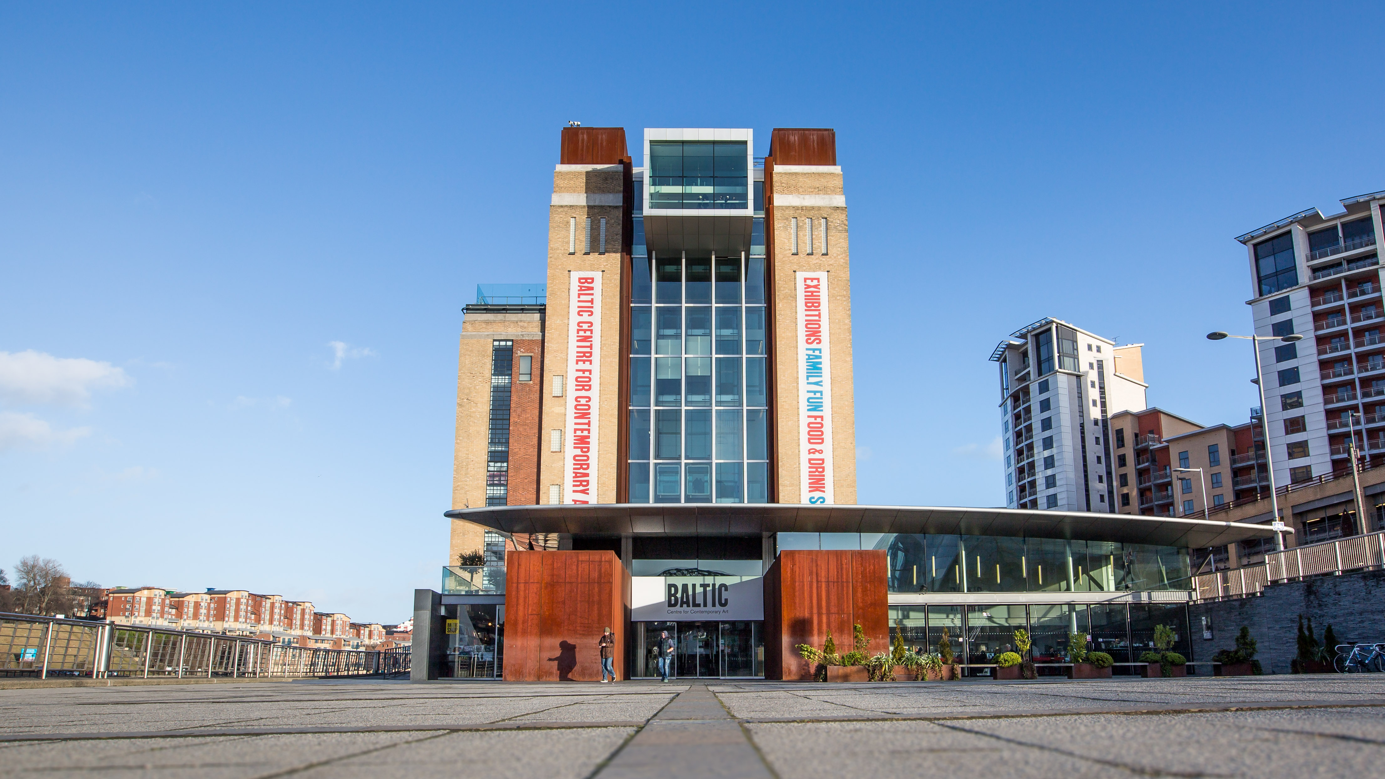 A photograph of the BALTIC Gateshead, a tall building in brick and glass.