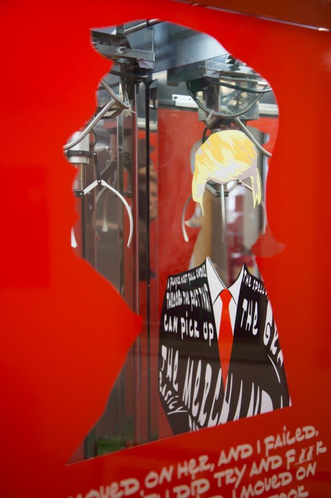 A grabber machine, usually found at galas and funfairs, themed on Donald Trump and 'make America great again'. 