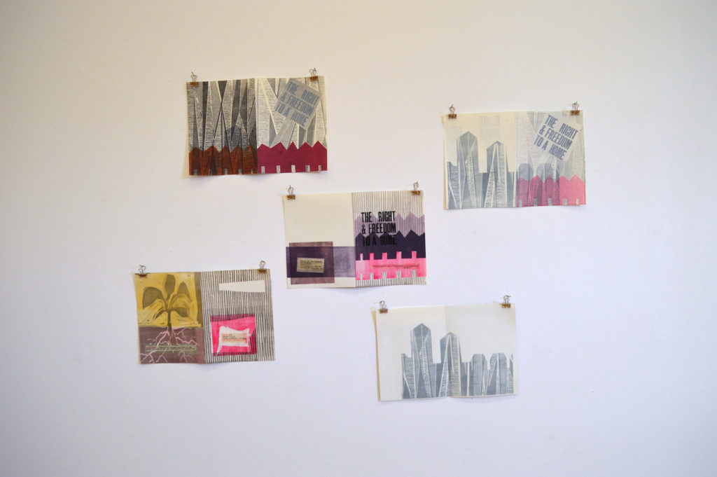Five prints hung close together on a white wall with bulldog clips. The prints show a variety of repeated motifs including a tower block and the words 'The right and freedom to a home'
