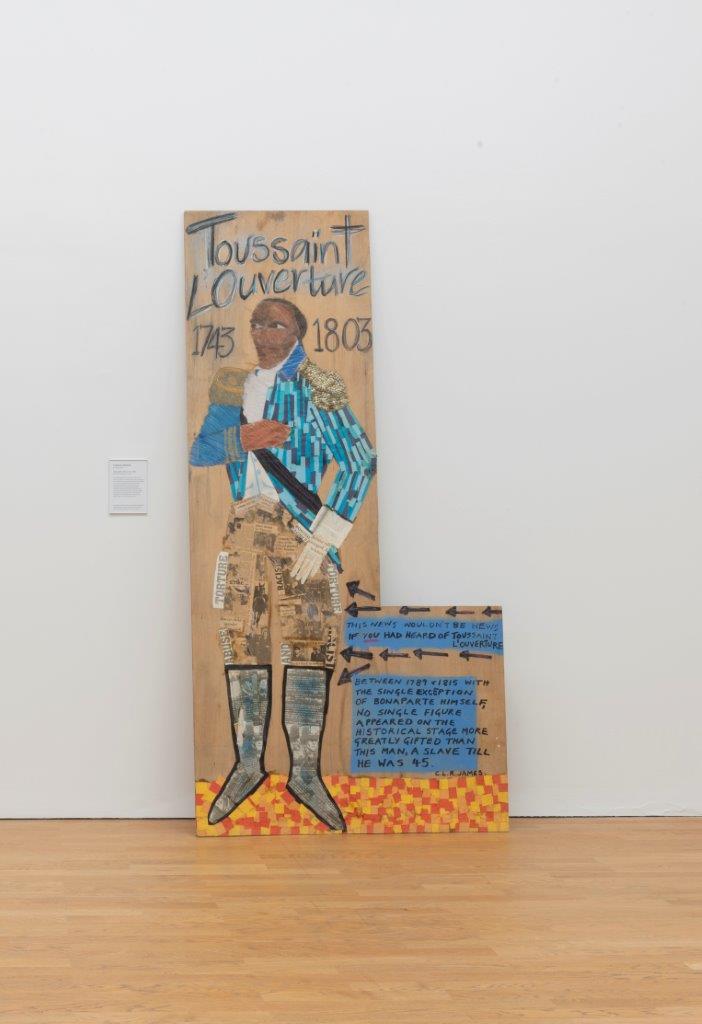 Lubaina Himid, 'Toussaint L’Ouverture', (1987). Himid depicts a man in smart military costume in a heroic stance, with a quotation reading: This NEWS WOULDN'T BE NEWS IF YOU HAD HEARD OF TOUSSAINT L'OUVERTURE. BETWEEN 1789 & 1815 WITH THE SINGLE EXCEPTION OF BONAPARTE HIMSELF, NO SINGLE FIGURE APPEARED ON THE HISTORICAL STAGE MORE GREATLY GIFTED THAN THIS MAN, A SLAVE TILL HE WAS 45. C.L.R. JAMES