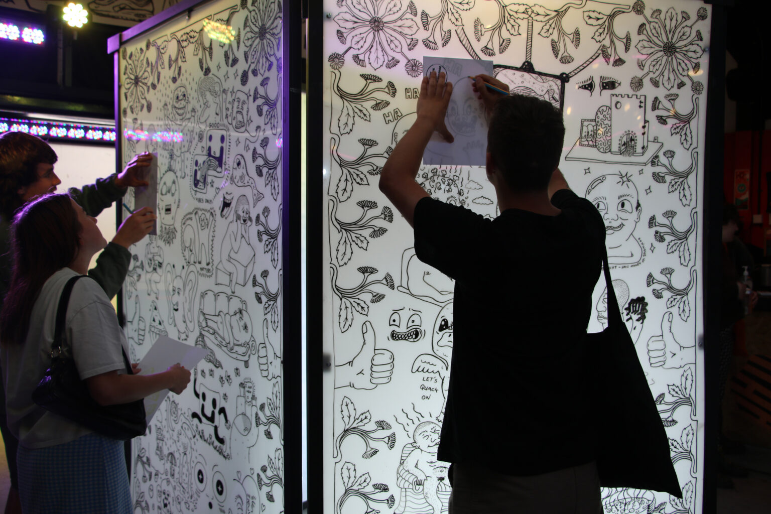 Photograph showing audience interaction with the tracing screen described in the article.