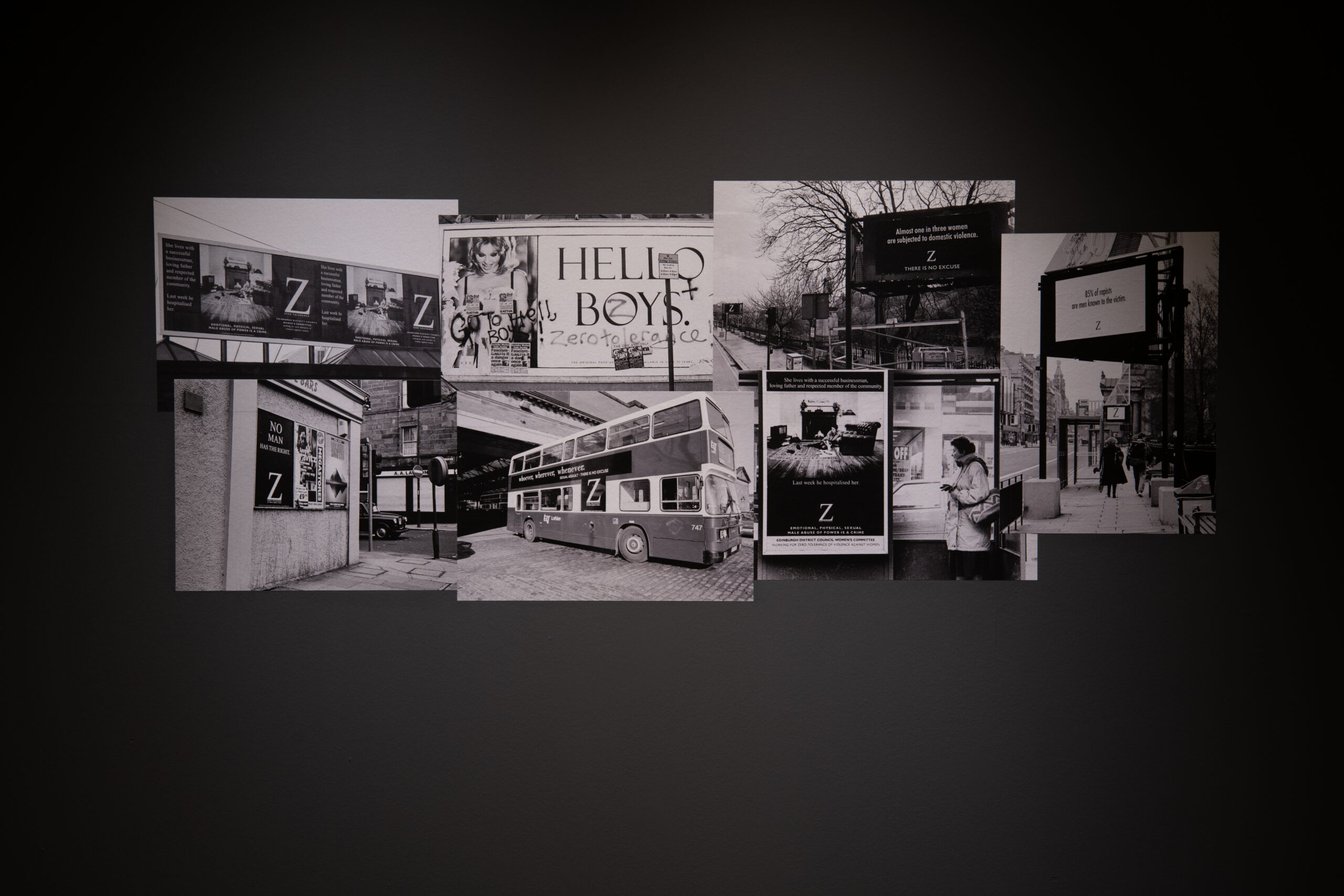 Seven black and white photographes displayed on a black wall. they are overlapping like a collage. They are images from the Zero Tolerance Campaign.