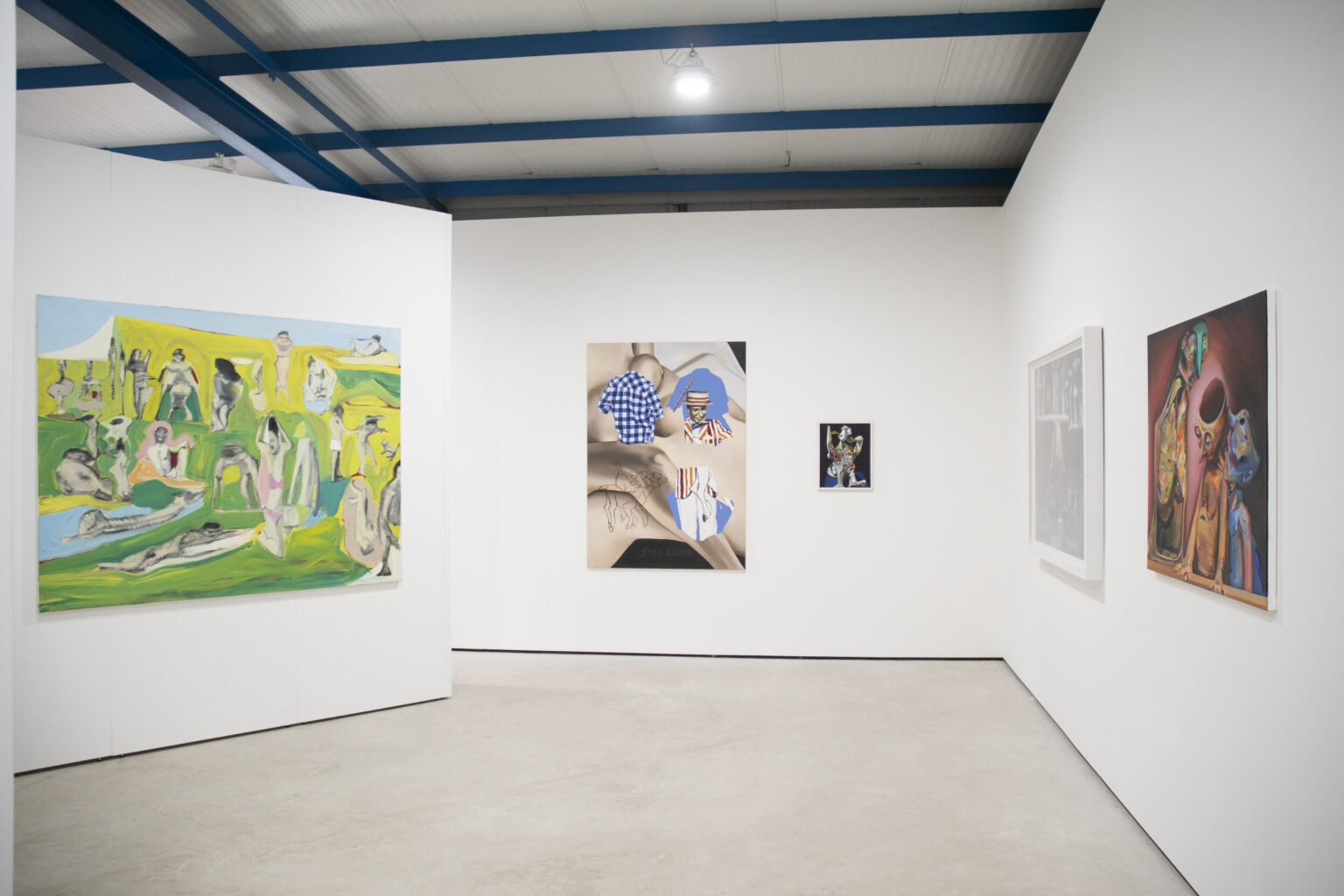 A view of the gallery with a large green and blue painting of a landscape filled with human figures to the laft and in the middle a piece of greys and blues